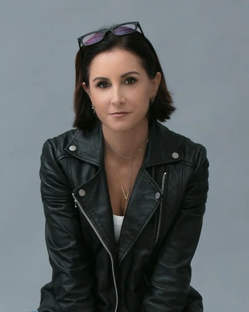 Dr. Niloo Dardashti in a black leather jacket